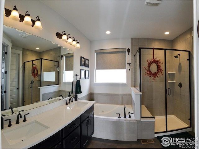 bathroom featuring tile patterned flooring, vanity, and separate shower and tub