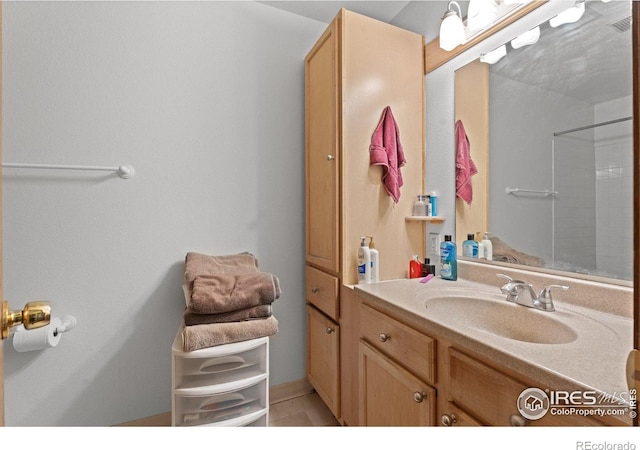 bathroom with vanity and walk in shower