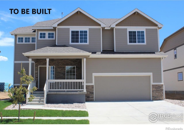 view of front of property featuring a porch and a garage