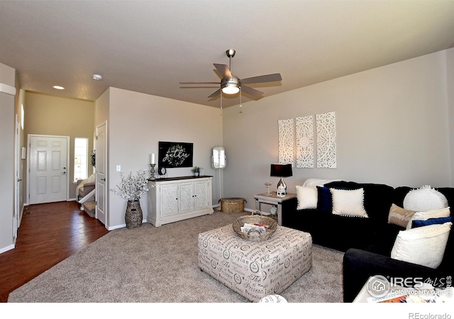 living room with wood-type flooring and ceiling fan