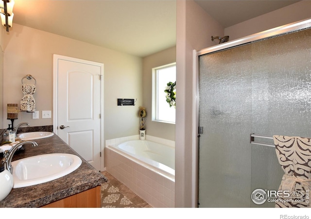 bathroom with tile patterned flooring, vanity, and independent shower and bath