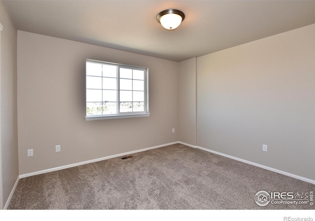 empty room with carpet flooring