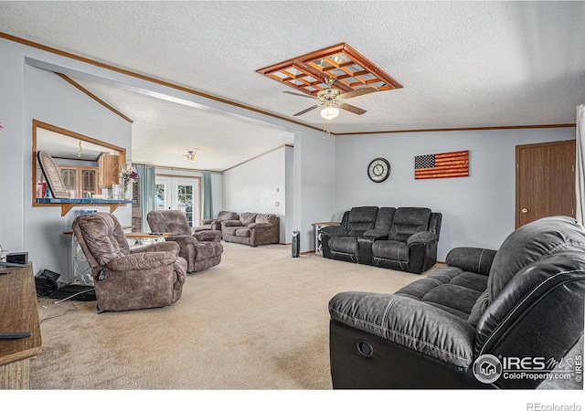 living room with carpet, ceiling fan, ornamental molding, and a textured ceiling