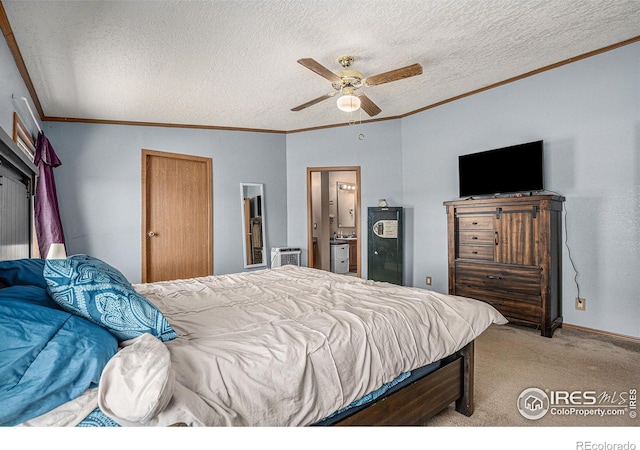 carpeted bedroom featuring ensuite bath, ceiling fan, vaulted ceiling, a textured ceiling, and ornamental molding