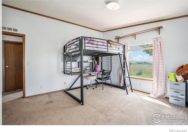 carpeted bedroom featuring crown molding