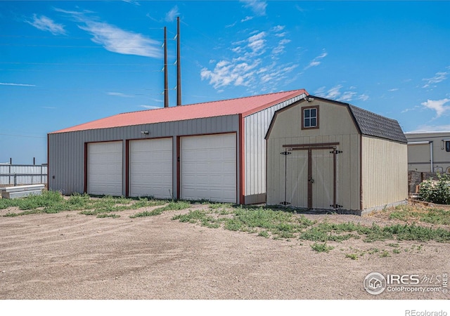 view of outbuilding with a garage