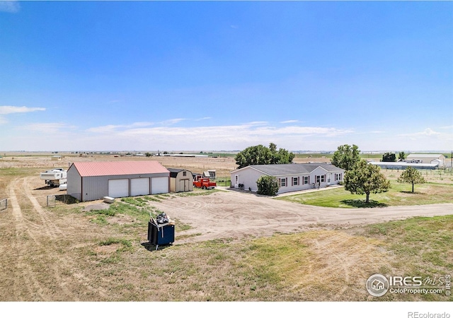 birds eye view of property with a rural view