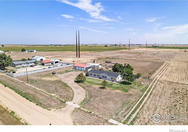 birds eye view of property with a rural view