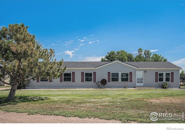 8260 County Road 39, Fort Lupton, CO 80621 - view of front facade with a front yard