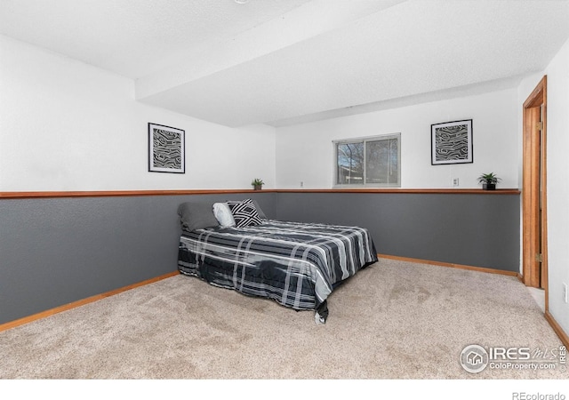 bedroom featuring light carpet