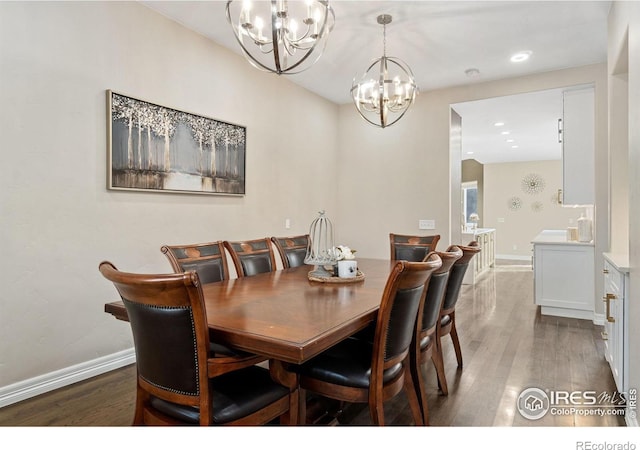 dining space with a chandelier and dark hardwood / wood-style floors