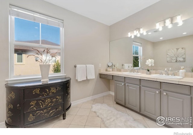 bathroom with tile patterned flooring and vanity