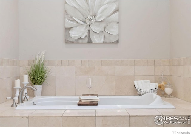 bathroom with tiled tub