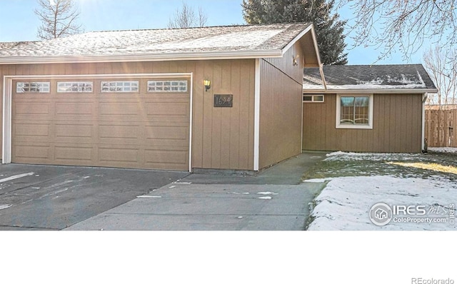 view of snow covered garage