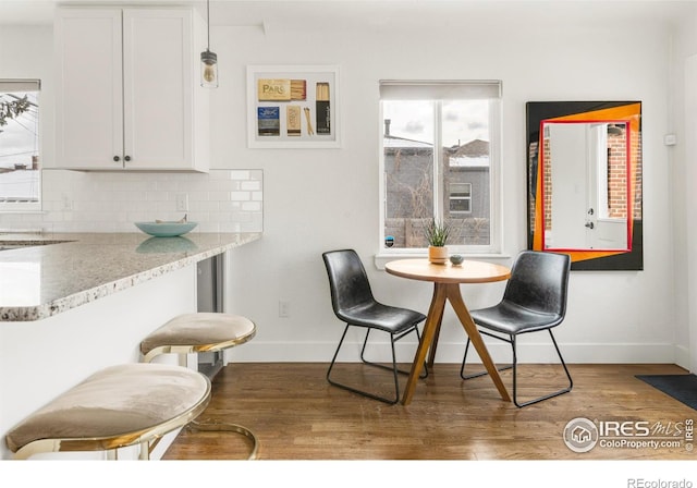 dining room with dark wood-type flooring