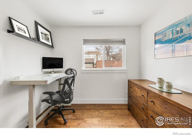 home office featuring hardwood / wood-style floors