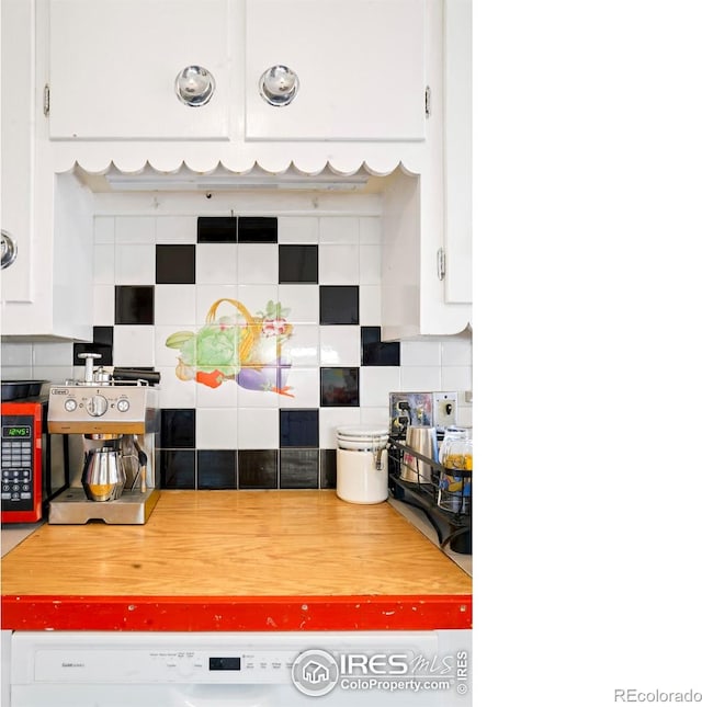 kitchen featuring decorative backsplash and white cabinets