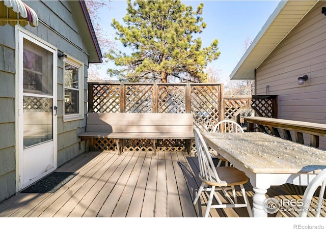 wooden deck featuring a bar