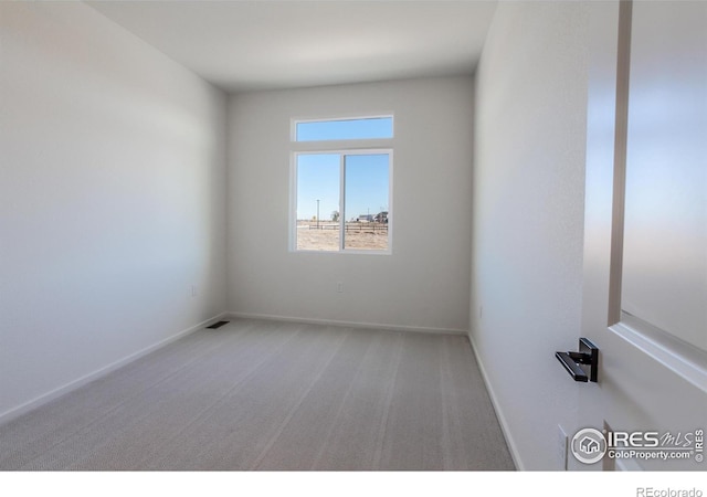 empty room with carpet flooring