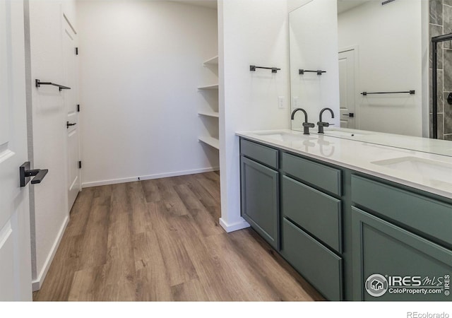 bathroom with vanity and hardwood / wood-style flooring