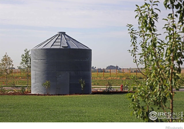 view of outdoor structure with a yard