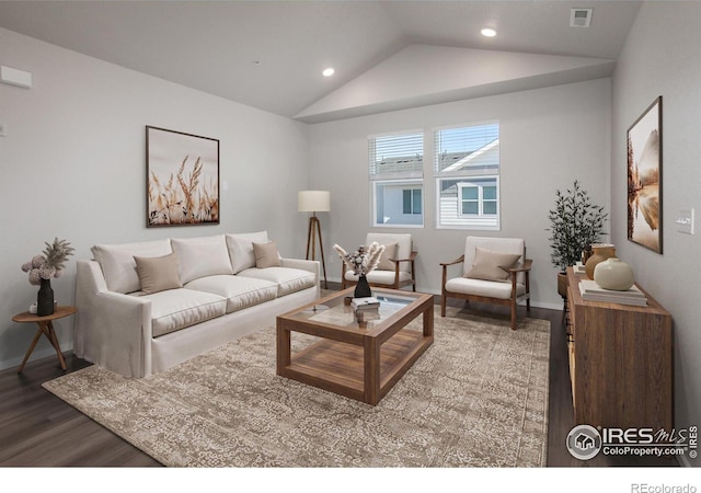 living room featuring hardwood / wood-style flooring and vaulted ceiling