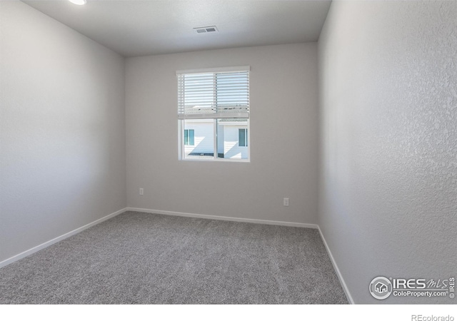 unfurnished room with carpet floors