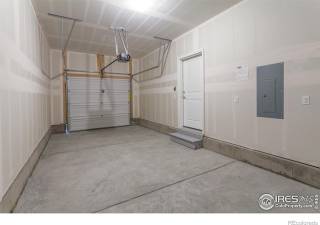 garage with electric panel and a garage door opener