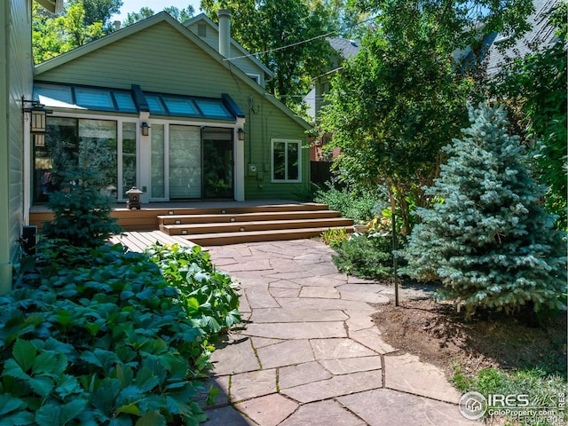 rear view of house with a deck