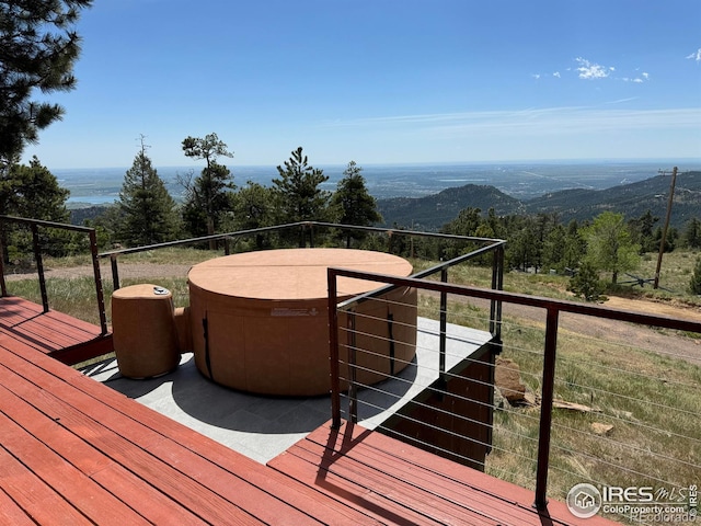 wooden terrace featuring a mountain view