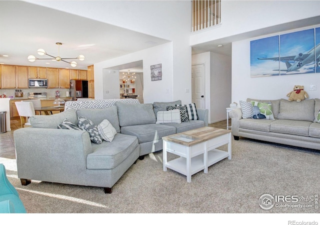 living room with an inviting chandelier