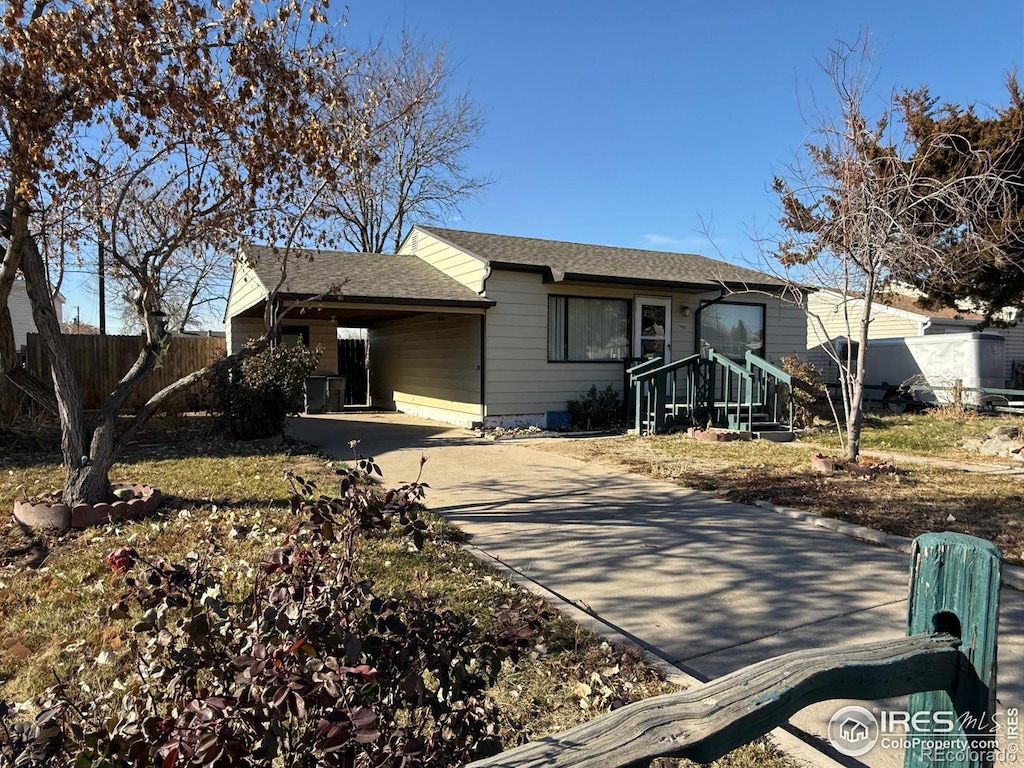 ranch-style home featuring a carport