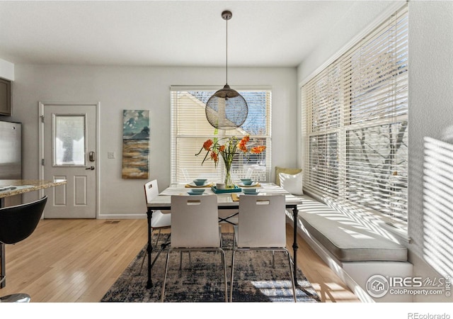 dining area with hardwood / wood-style floors