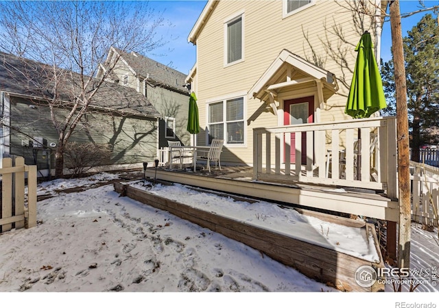 view of snow covered deck