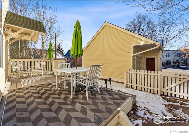 view of snow covered deck