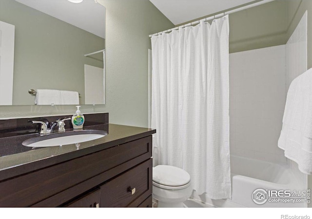 full bathroom featuring vanity, shower / bath combination with curtain, and toilet