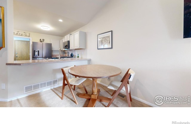 view of carpeted dining room