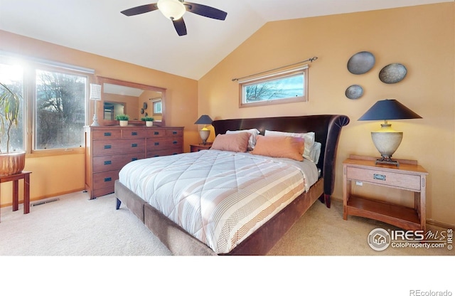 carpeted bedroom featuring ceiling fan and lofted ceiling