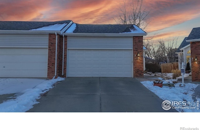 view of snow covered garage