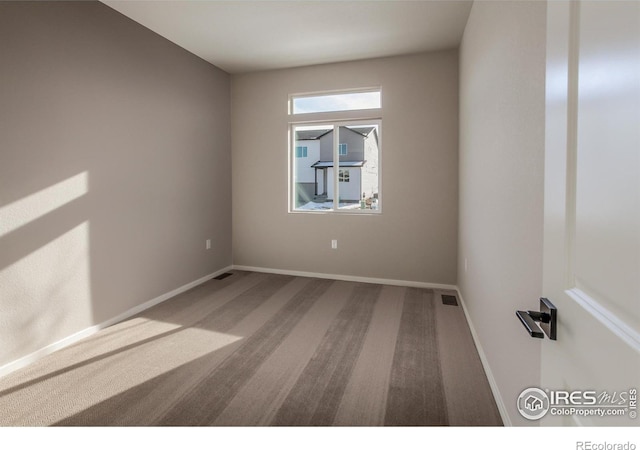 empty room featuring carpet flooring