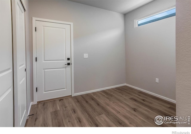 spare room featuring hardwood / wood-style flooring