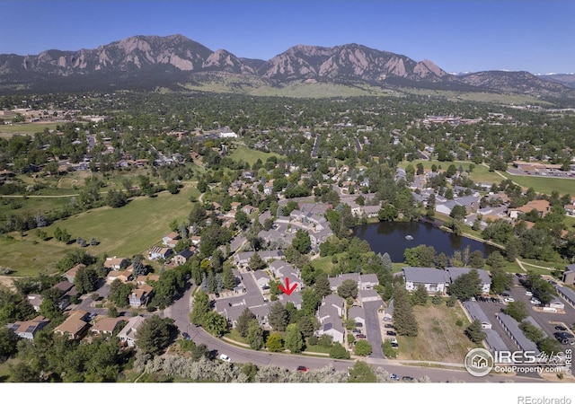 bird's eye view with a water and mountain view