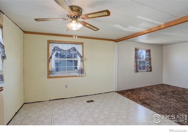 spare room with ceiling fan