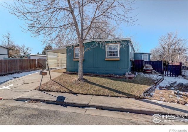 view of outbuilding featuring a yard and a carport