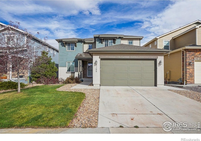 view of front of property featuring a garage and a front yard