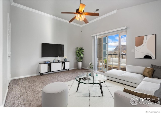 carpeted living room with ceiling fan and ornamental molding