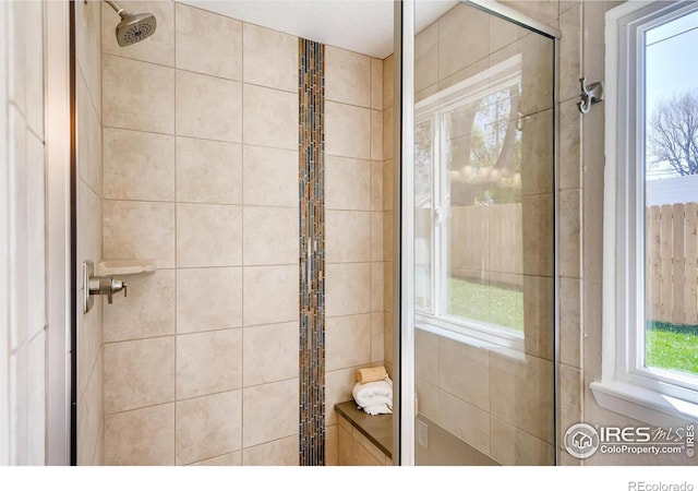 bathroom featuring a tile shower