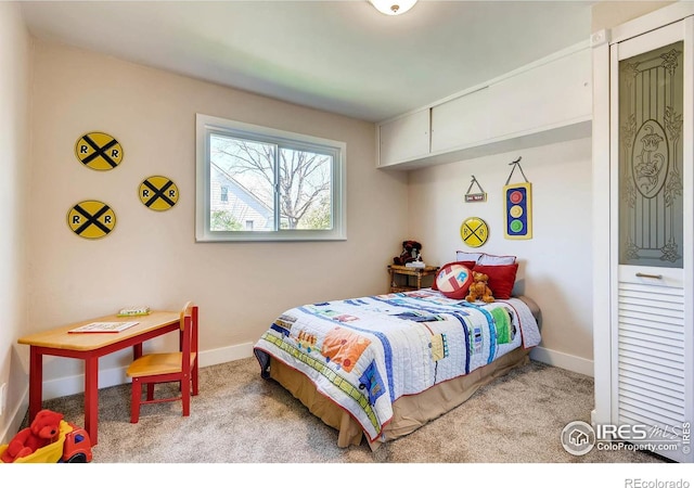 bedroom featuring light colored carpet