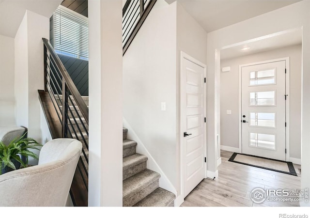 foyer entrance with light hardwood / wood-style flooring