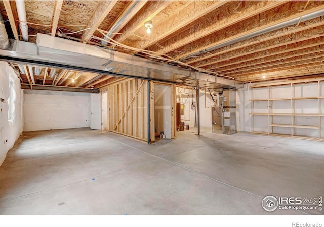 unfinished basement with heating unit